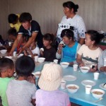 Enjoying soup made from the school vegetables Enjoying soup made from the school vegetables